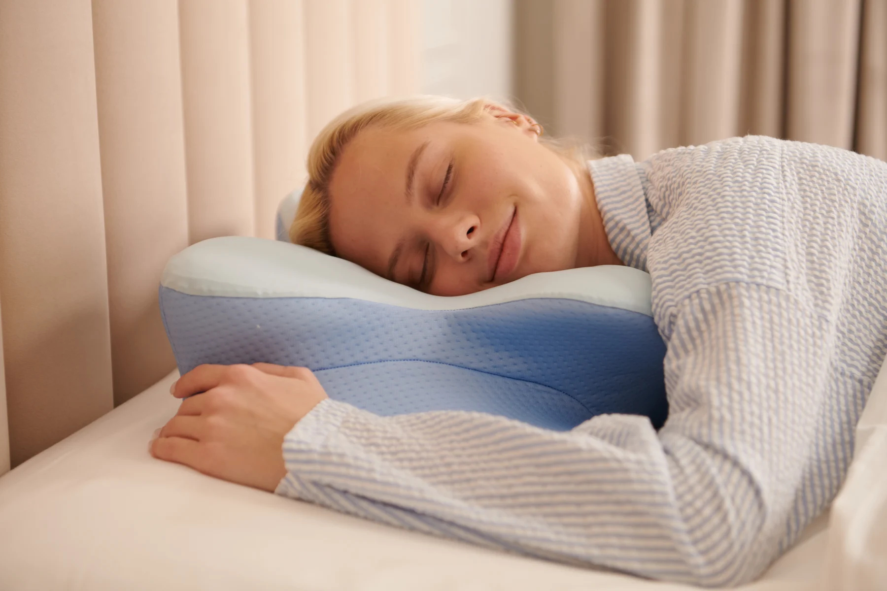 Contoured pillow arranged in a calm bedroom